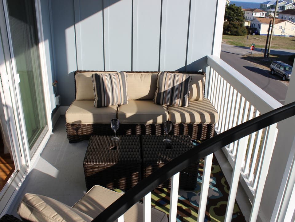 Third floor deck with plenty of cushioned seating to enjoy your morning coffee! 