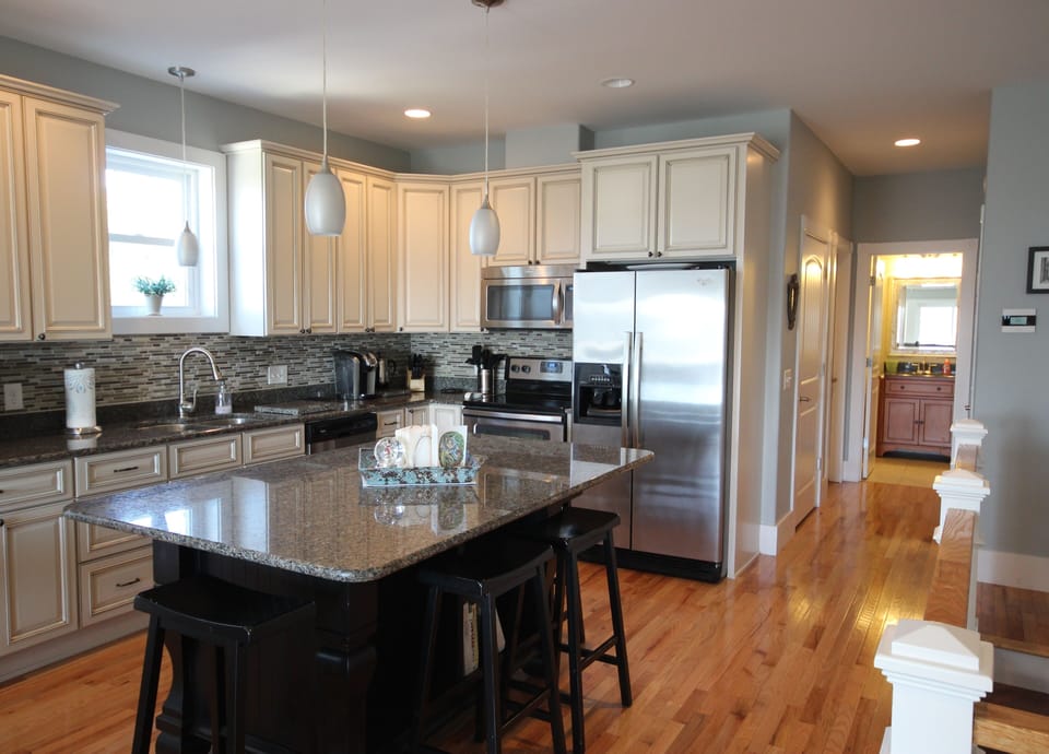 The custom kitchen features a large center island.