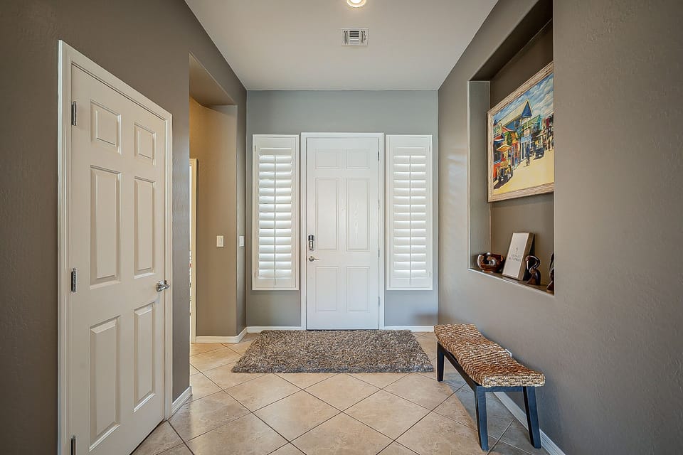 Front entrance way with coat closet.