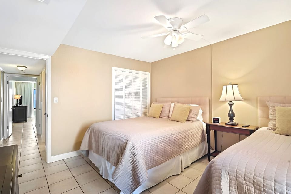 Queen and single beds in the front bedroom