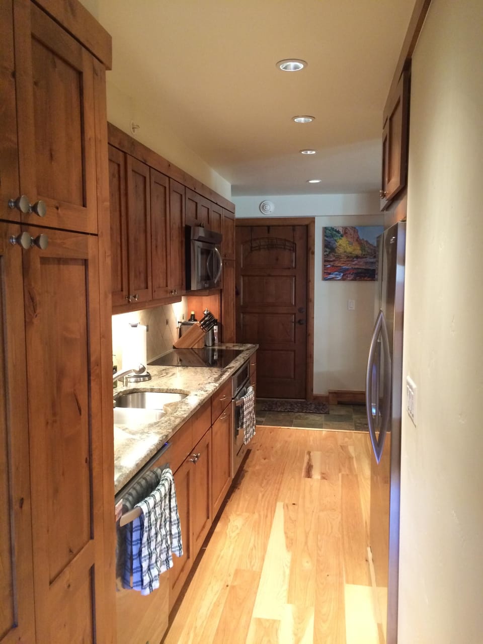 View from far side of kitchen back to front door