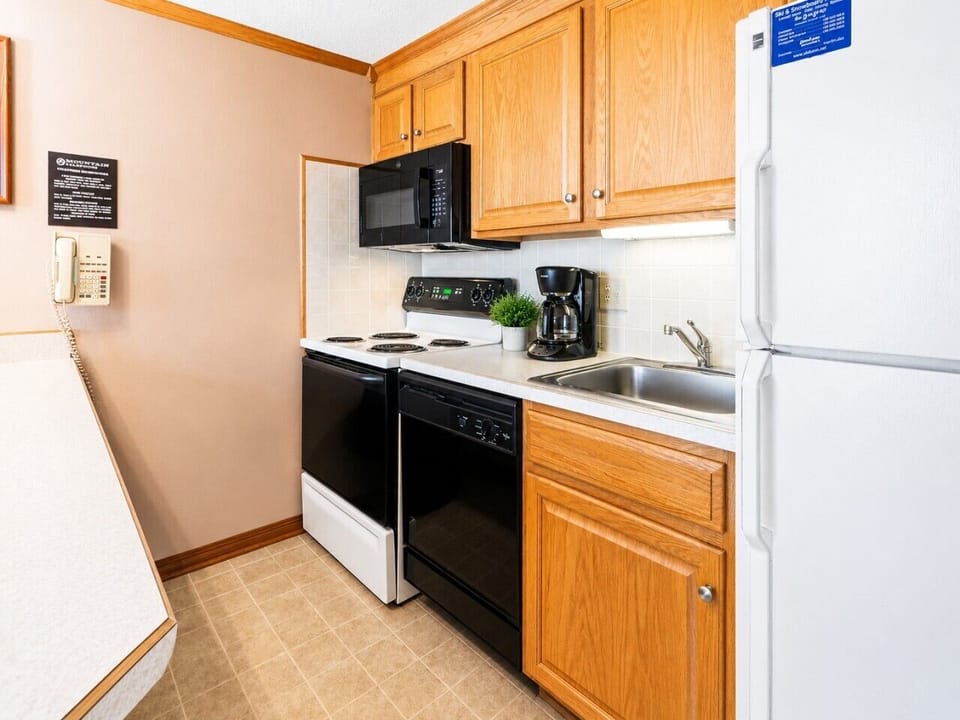 Remodeled kitchen is fully-equipped with pots, pans & utensils