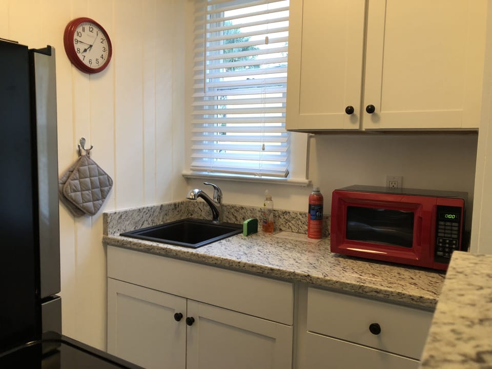Fully equipped kitchen with including dishwasher, coffeemaker, toaster microwave