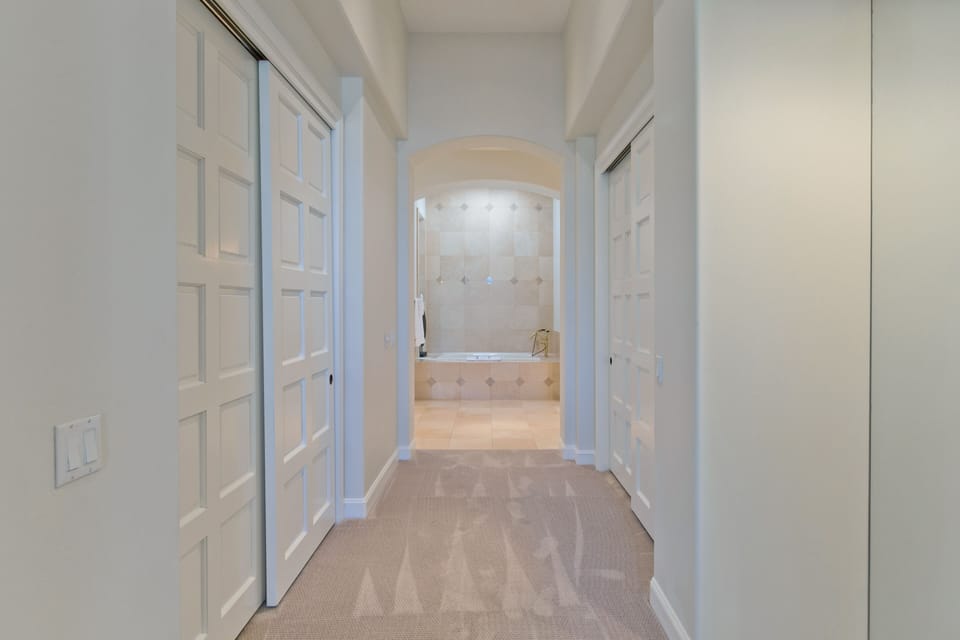 Master bedroom hallway to bathroom with two huge cedar lined closets.