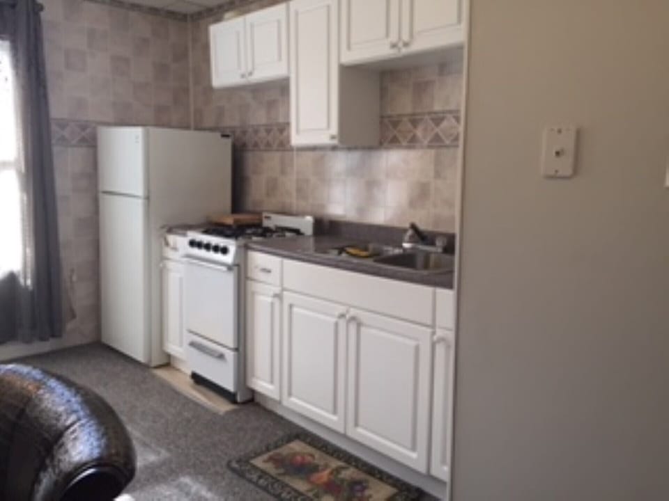 Full kitchen with mirco wave, coffee maker, toaster , dishes, cookware