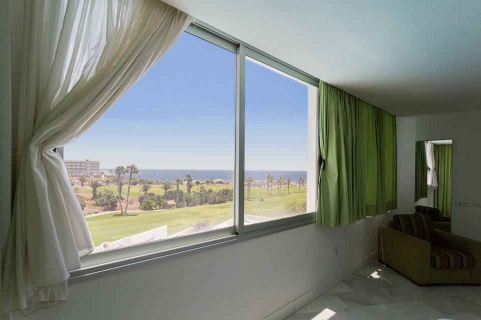 Main bedroom with private terrace and huge window on the golf field and pool