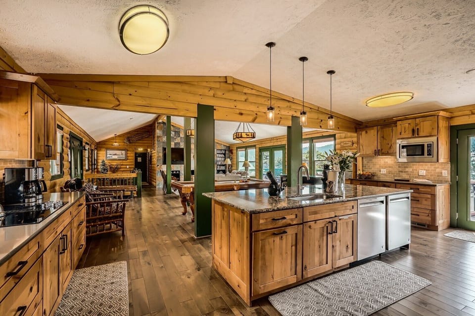 Kitchen, pool table, living room with smart tv. Main deck off of this area