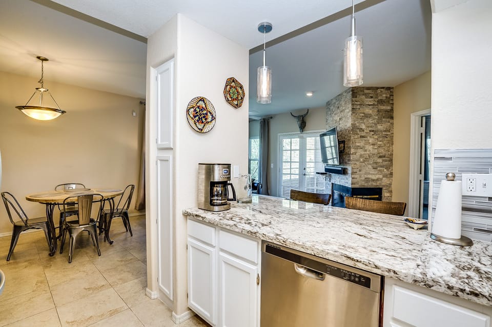 Dining area includes mountain views, warm dimmable lighting