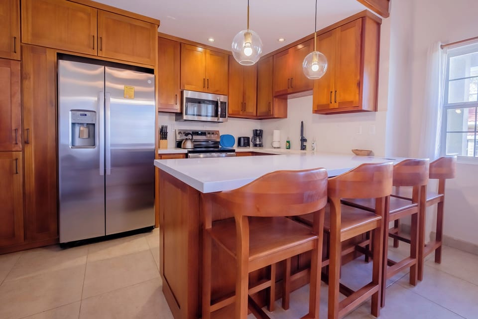 Newly remodeled kitchen with quartz counter tops and new appliances