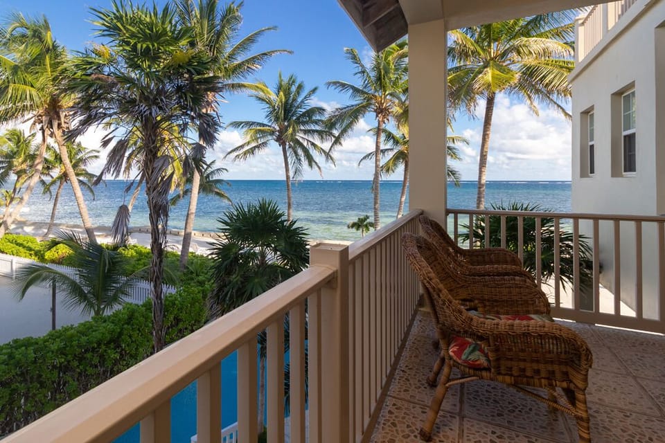 Patio view of pool, beach and ocean