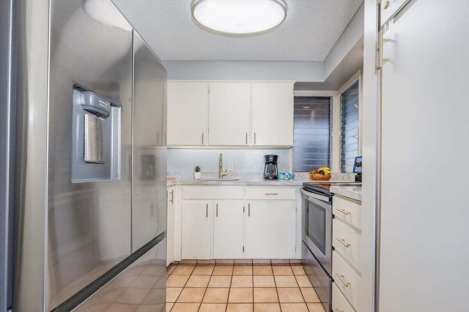 Enjoy cooking at your fully furnished kitchen with stainless steel appliances