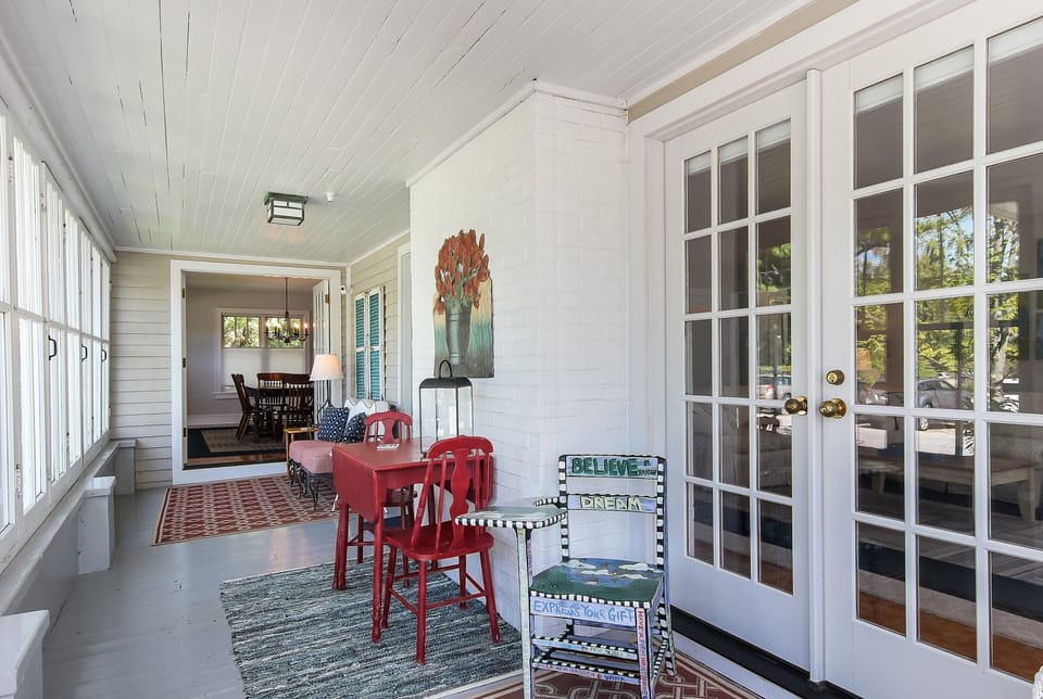 Enclosed front porch great remote office or entertaining space for parties+games