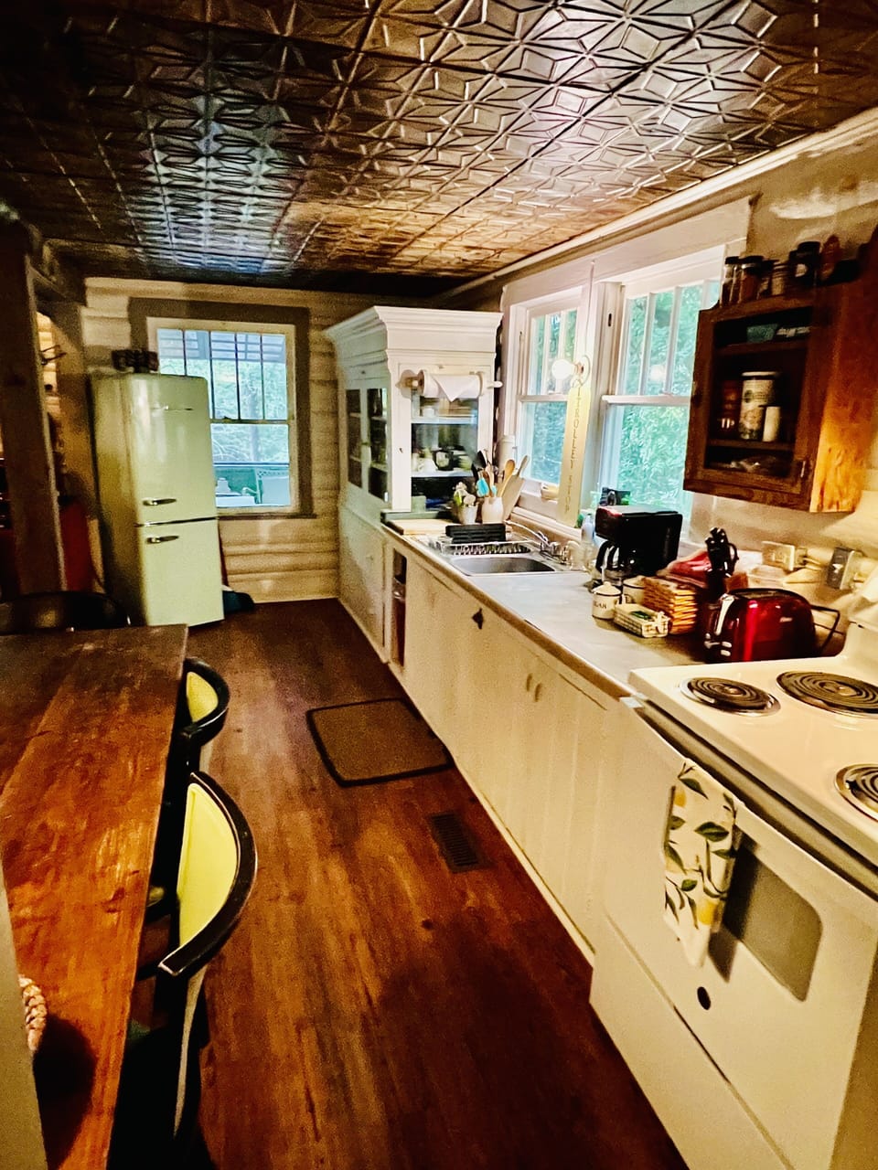 Kitchen with all you need. Cute seafoam green retro refrigerator.