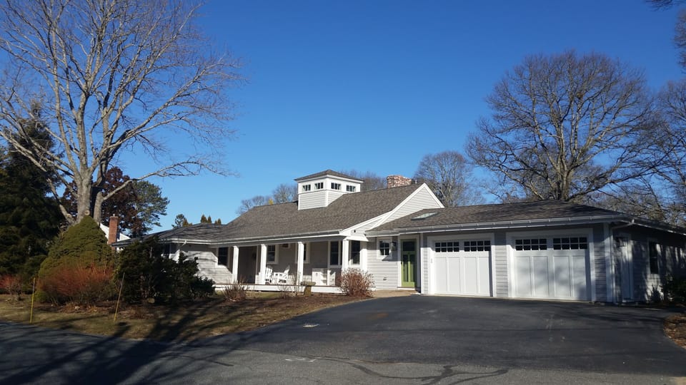 Driveway view in winter. House is larger than it looks from the street.