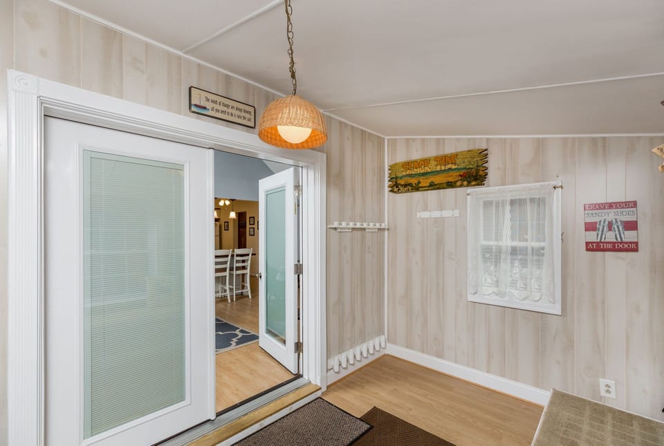The Mud Room offers extra storage and lovely doors lead to the Main House.