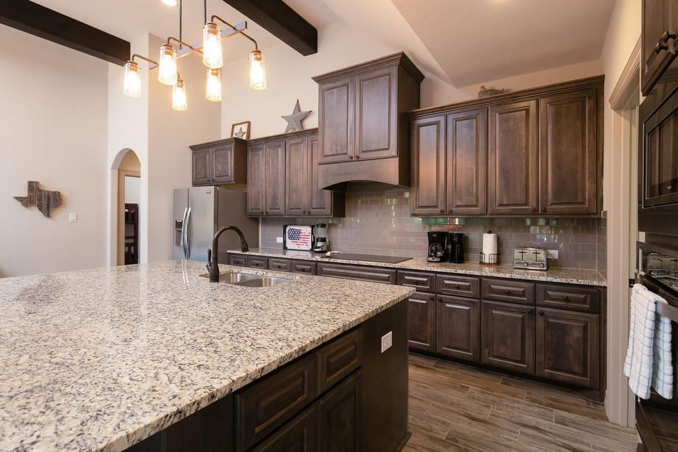 kitchen has all new appliances and comes fully stocked with cookware, dishes, and utensils. 
Standard drip coffee maker.