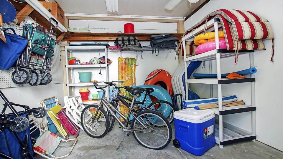 Chairs, coolers, umbrellas and beach toys are ready for you to use.