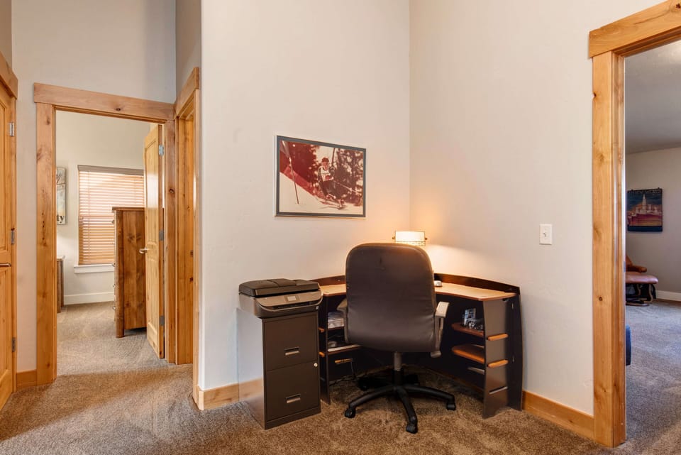 Bear Hollow Village 5639: Minimalist desk and chair set up in a cozy study nook.