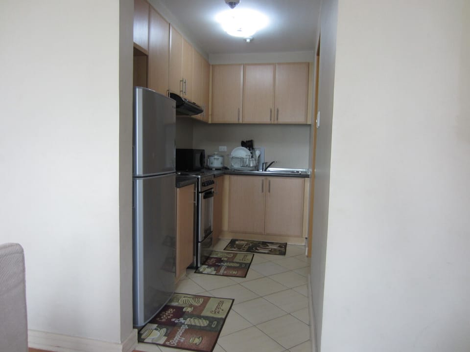 Condo unit kitchen - with full kitchen wares, ref, electric range, full dining
