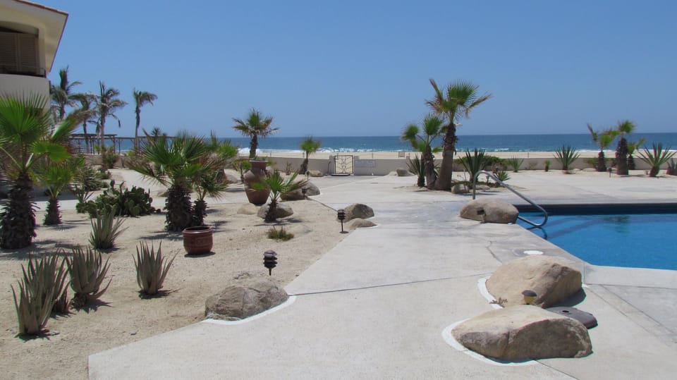 Relax by the pool or step onto the beach