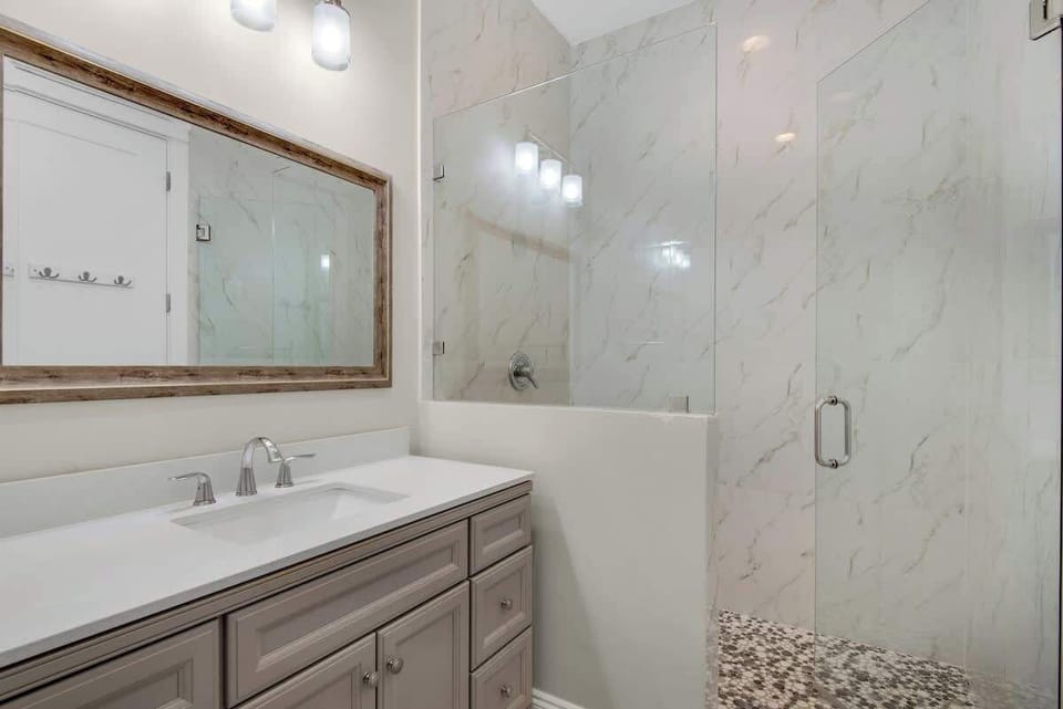 Luxurious Bathrooms, All Tiled Showers and Roomy Vanity Areas