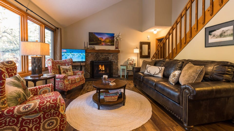 Living Room - filled with local art, wonderful views of river, gas fireplace