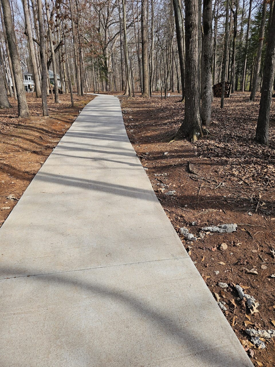 Concrete walkway to lake.