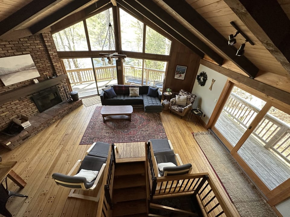 Plenty of space to relax and get cozy with wood burning fireplace, couch, recliners and blankets.