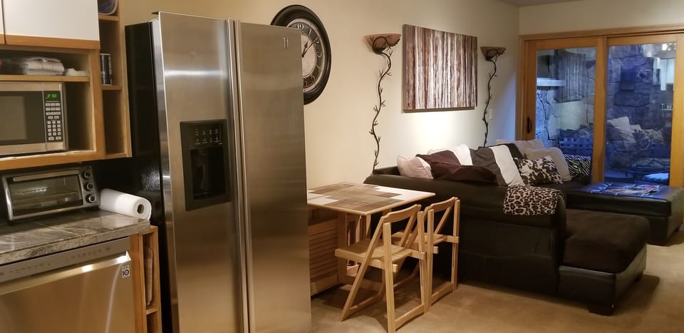 Drop leaf  table seats 2 when open half-way for seating or computer use.