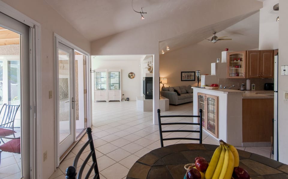 Long view from Dinette area of Kitchen, Dining Room, & Living Room.
