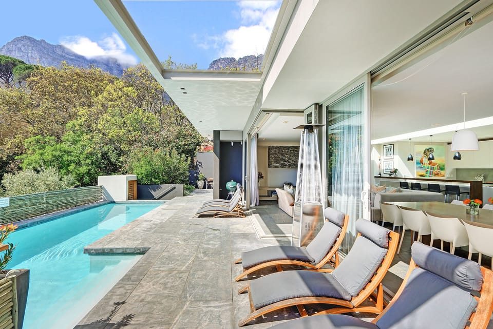 Enjoy a sundowner by the pool whilst watching the sunset over the Atlantic Ocean