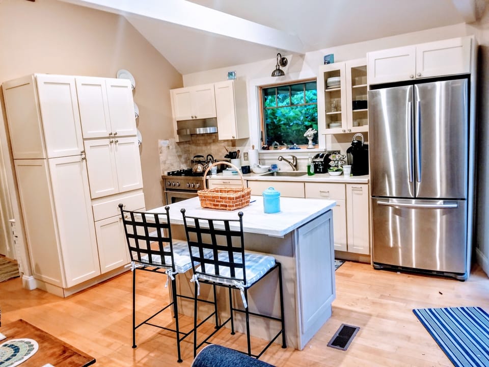 Chef’s kitchen with gas range and breakfast bar
