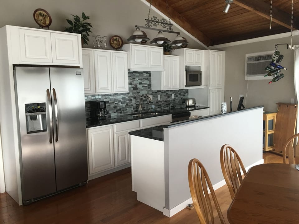 The new kitchen: cabinets, counter tops, back splash and appliances.