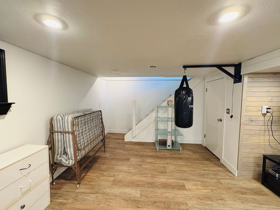 Workout area downstairs with extra rollaway bed for extra sleeping accommodation