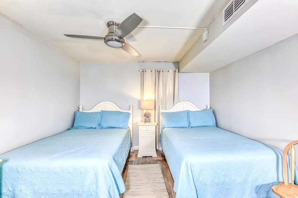 Two double beds in front bedroom