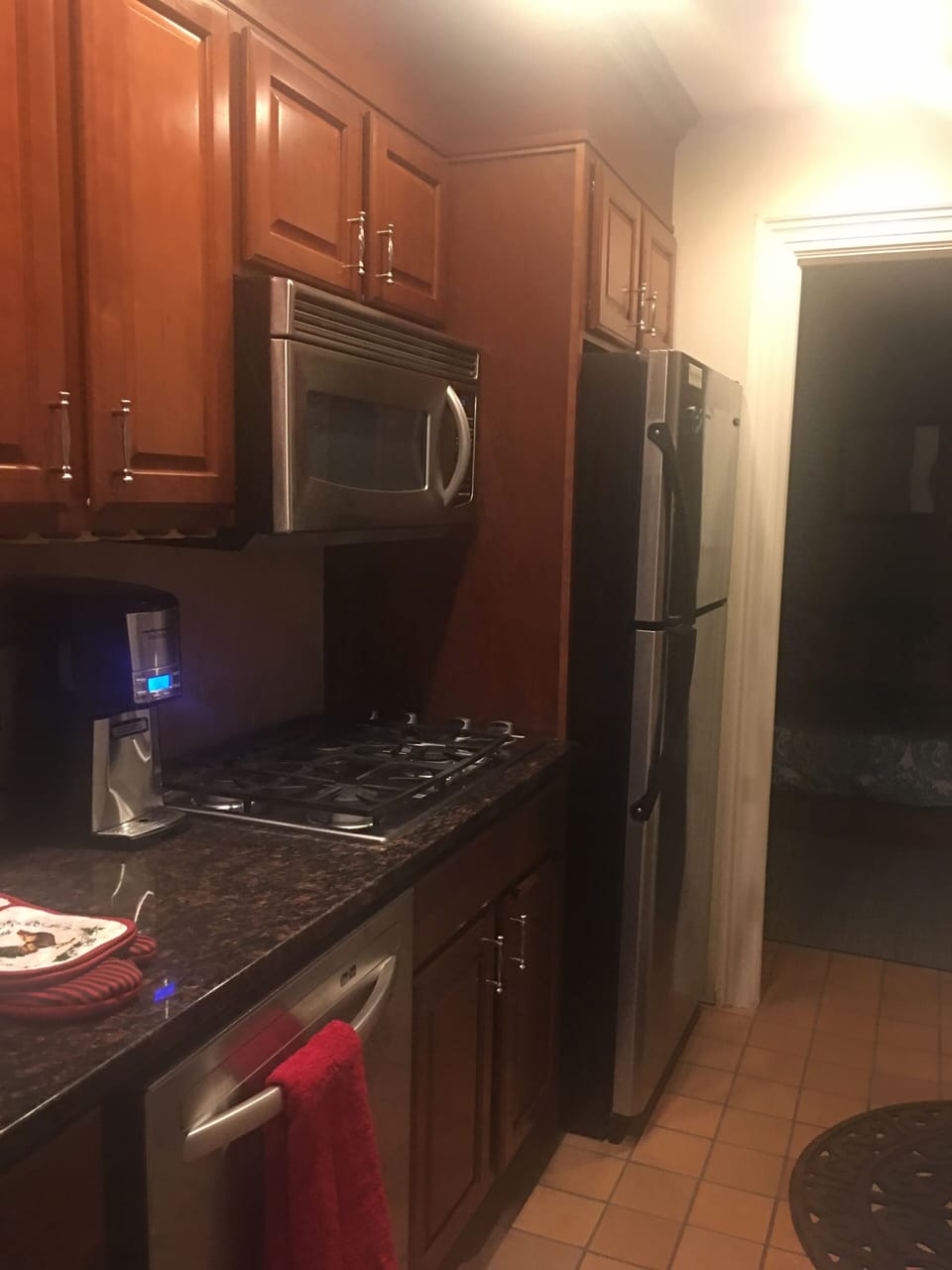 Kitchen with granite countertop and stainless appliances