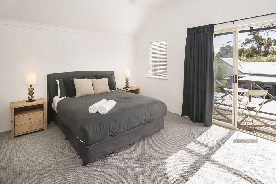 The spacious master bedroom  features an ensuite and private balcony.