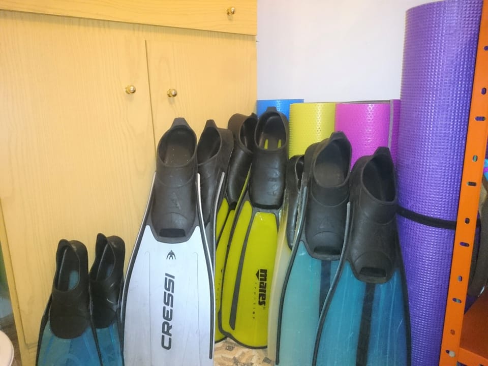 Roll up foam beach mattresses and snorkelling fins for guests