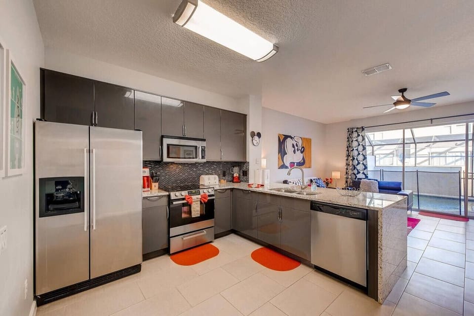Open-style kitchen with ample counter space and easy flow into the dining and living areas
