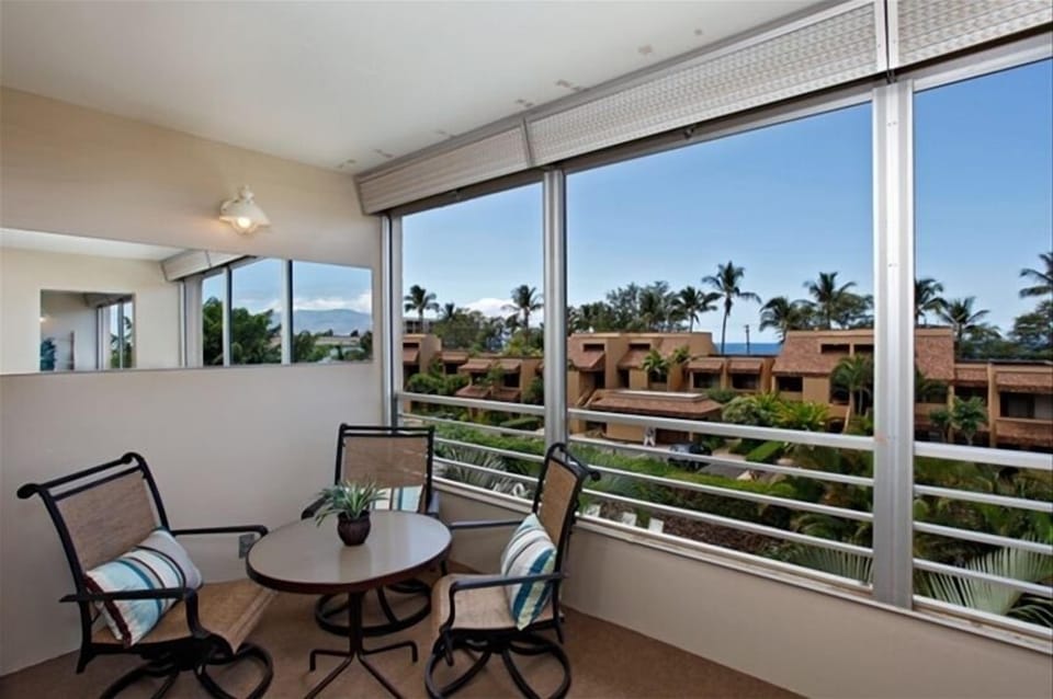Enjoy a cocktail & view from the living room lanai