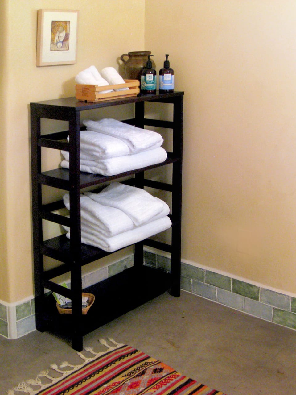 Fluffy towels and natural body products in the bathroom