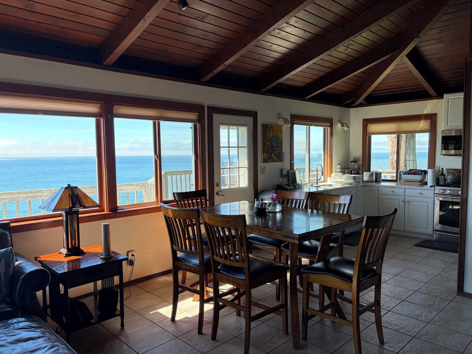 Dining table with counterheight seats and kitchen complete the open floor plan