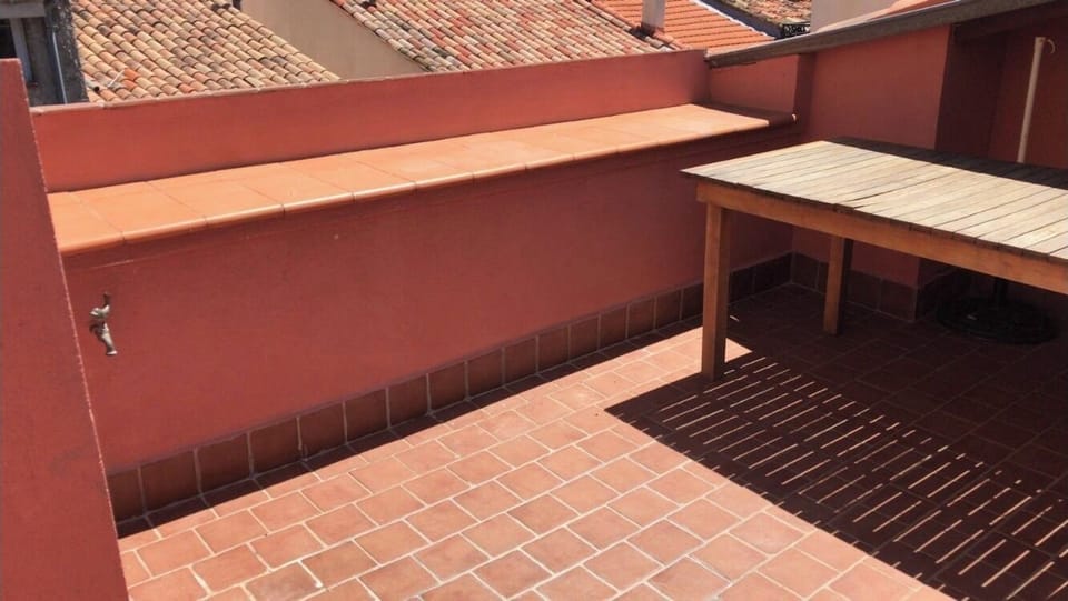 Sunny terrace with dining seating for 6 people and 2 sun loungers