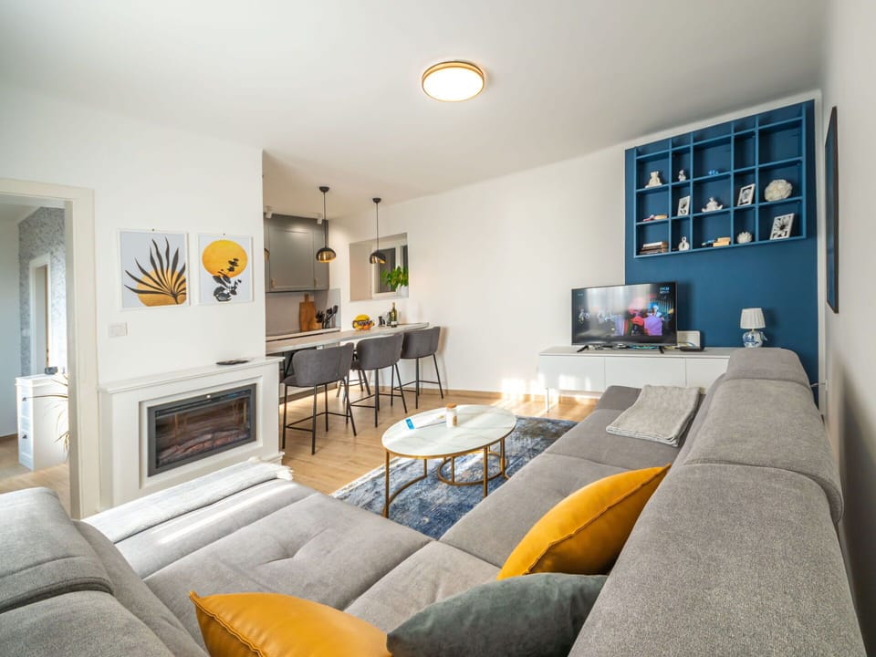 Furniture, Property, Couch, Picture Frame, Table, Orange, Interior Design, Television, Comfort, Living Room