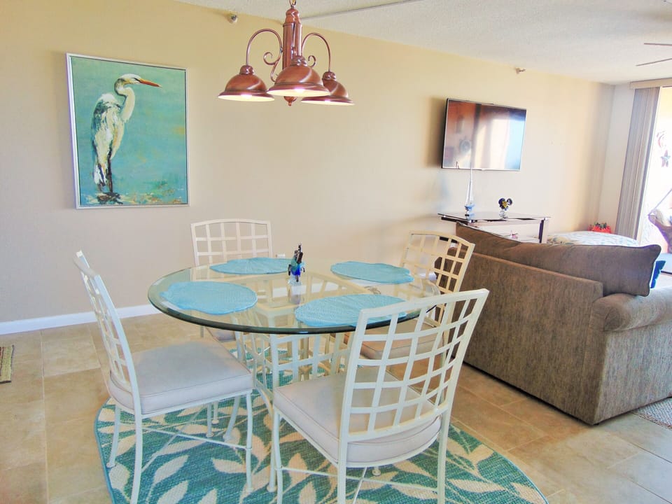 The dining room has seating for four people. Also has an amazing view...  55" tv