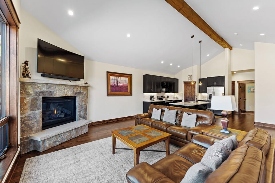 Sink into plush leather seating by your stone fireplace, while the open kitchen invites you to create memorable meals together.
