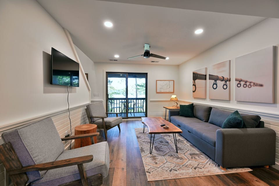 Living area with lake views and sofa sleeper.