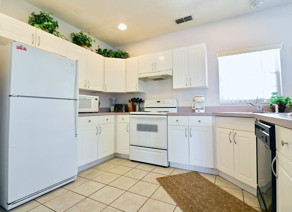 A fully equipped kitchen provides everything needed to prepare a family meal