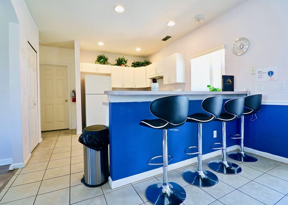 Convenient breakfast bar adjacent to the kitchen