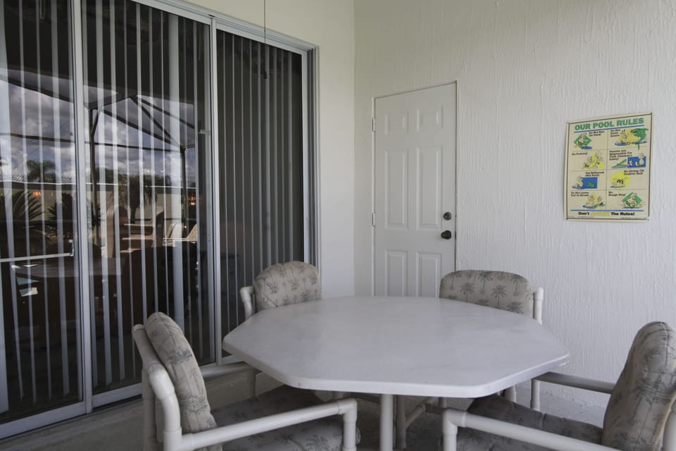 Out side patio table near pool 